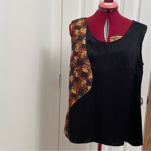 Handmade women satin unknown fibre sleeveless high low top. Size 14. Used.